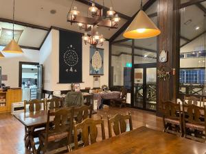 a dining room with a table and some chairs at Koguriyama Sanso - Vacation STAY 14530v in Minami Uonuma