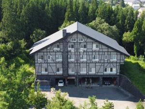 an aerial view of a large house with trees at Koguriyama Sanso - Vacation STAY 14530v in Minami Uonuma