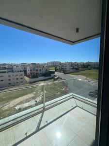 an open window with a view of a street at Amazing brand-new apartment in Abdoun! in Amman