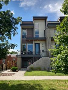 a large house with a balcony on the side of it at Upscale Townhome w/ Stunning Rooftop Views in Denver