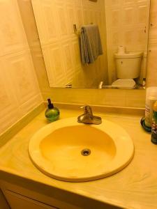 a bathroom counter with a sink and a mirror at New-Paradisus Beach & Pool-Best rate guaranteed! in Dorado