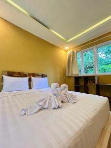 Voodi või voodid majutusasutuse BAMBOO OASIS toas