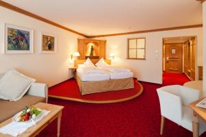 Ένα ή περισσότερα κρεβάτια σε δωμάτιο στο Hotel Solaria Ischgl - 4 superior