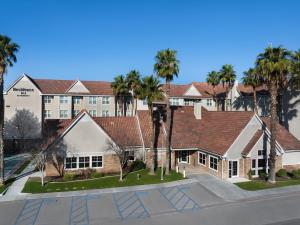 an aerial view of a building with palm trees at Residence Inn by Marriott San Bernardino in San Bernardino