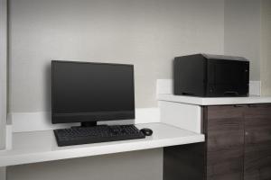 a desk with a computer monitor and a printer at Residence Inn by Marriott San Bernardino in San Bernardino