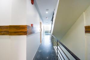 a hallway of a building with a stairway at HC Sohana inn in Sohāna