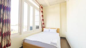 Postel nebo postele na pokoji v ubytování 158A Hotel