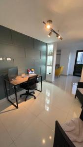 a room with a table with a laptop on it at Luxurious apartment located in the heart of Panama in Panama City