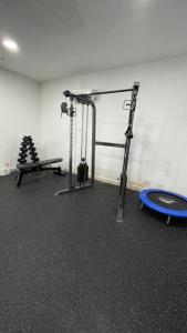 a fitness room with a gym with a blue frisbee at Luxurious apartment located in the heart of Panama in Panama City