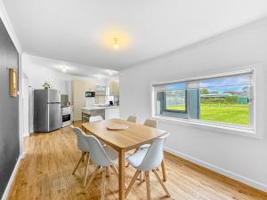 a kitchen and dining room with a table and chairs at No. 231 Waterfront in Portland