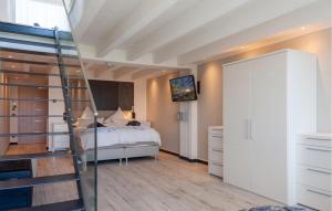 a bedroom with a bed and a ladder in it at Prora Solitaire Avida Loft15 in Binz