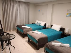 Voodi või voodid majutusasutuse Vianca Hotel toas