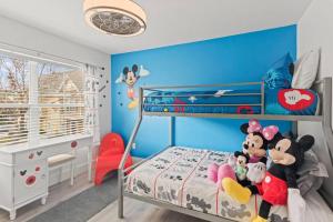 a bedroom with a mickey mouse bunk bed at The Villas at Seven Dwarfs - 2603 Amazing Luxury Villa - Near Disney - Water Park in Kissimmee +59 photos
