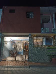 a gate on the front of a house at Casa Chero in Comalcalco