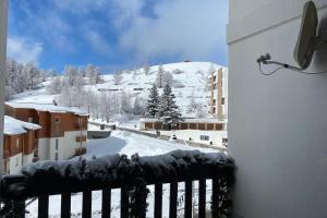 a view of a snow covered mountain from a balcony at 06BP - Beautiful 6-person apartment in Valberg in Valberg