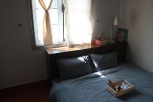 Postel nebo postele na pokoji v ubytování Thịi house