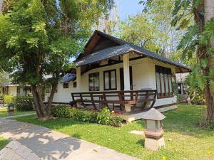 a small house with a bird feeder in front of it at Fisherman's Resort Haad Chao Samran in Haad Chao Samran