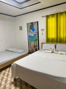 Ένα ή περισσότερα κρεβάτια σε δωμάτιο στο Noah Xye Guest House +30 φωτογραφίες