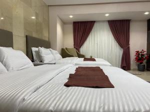 Ein Bett oder Betten in einem Zimmer der Unterkunft Aziz Egypt Pyramids View
