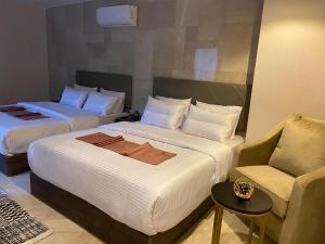 Ein Bett oder Betten in einem Zimmer der Unterkunft Aziz Egypt Pyramids View