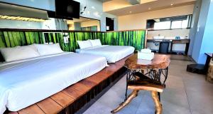 Voodi või voodid majutusasutuse Xinghaiwan B&B toas