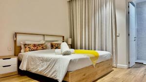 Postel nebo postele na pokoji v ubytování Appartement de luxe piscine et vue mer