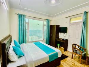 a bedroom with a bed and a large window at Royal Green Valley View Mashobra in Shimla