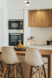 Kuchyň nebo kuchyňský kout v ubytování Appartement de luxe piscine et vue mer