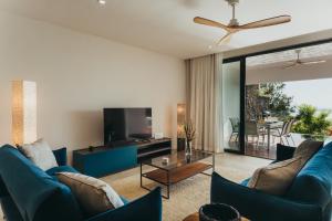 Posezení v ubytování Appartement de luxe piscine et vue mer