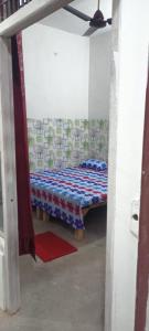 Voodi või voodid majutusasutuse Maharishi Valmiki Homestay toas