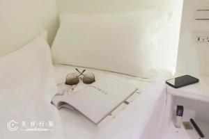 Letto o letti in una camera di Wondertime Taipei Station - Kaifeng Ladies Hostel