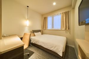 Voodi või voodid majutusasutuse Via inn Kyoto Shijomuromachi toas