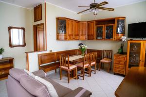 a kitchen and dining room with a table and chairs at Relaxing House in Lido di Ostia