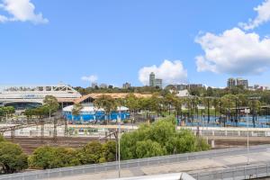 a view of the fnb stadium from the roof of a building at East Melbourne 2BR Apartment in Melbourne