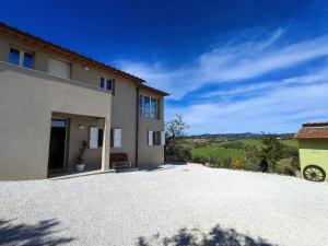 a house with a large driveway in front of it at Tuscany Hills La Veduta in Certaldo