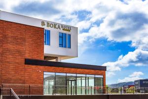 a building with a sign on the side of it at Hotel Boka in Kotor