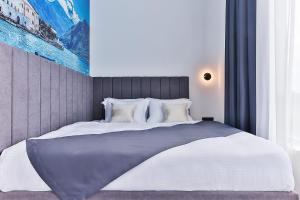 Postel nebo postele na pokoji v ubytování Hotel Boka