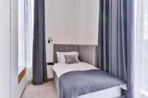 Postel nebo postele na pokoji v ubytování Hotel Boka