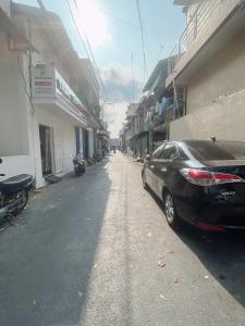 a black car parked on the side of a street at TRUNG LUONG HOMESTAY in Trung An