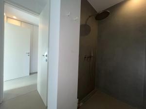 a room with a hallway with a door and a wall at Villa Serene Milos in Empourios