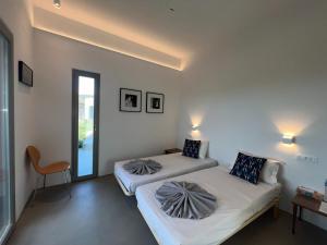 Posteľ alebo postele v izbe v ubytovaní Villa Serene Milos