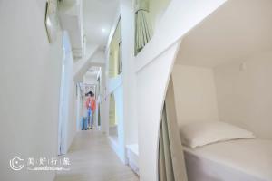 Letto o letti in una camera di Wondertime Taipei Station - Kaifeng Ladies Hostel