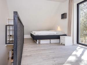 Кровать или кровати в номере Holiday home Hovborg XV