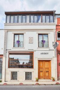 a white building with windows and a door at Ardey Hotel in Istanbul