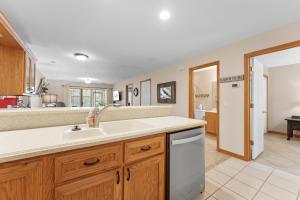 a kitchen with a sink and a dishwasher at Dog-Friendly Quiet Cove Condo in Hollister