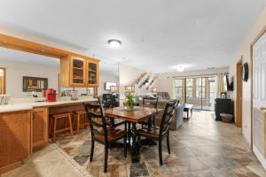a kitchen and dining room with a table and chairs at Dog-Friendly Quiet Cove Condo in Hollister