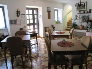 a dining room with wooden tables and chairs at Alloggio Turistico La Balocca in Montefiascone