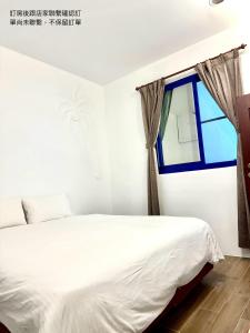Postelja oz. postelje v sobi nastanitve Nanwan254 Homestay