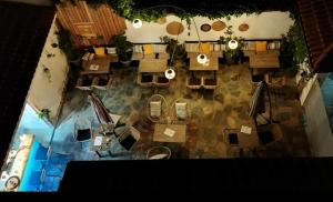an overhead view of a restaurant with tables and chairs at Dionisos Hotel in Nei Poroi
