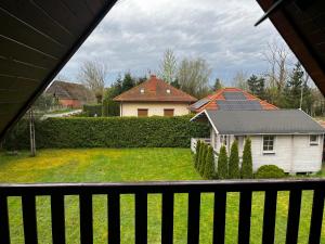 a view of a house from a balcony at Prywatny domek Janusz in Jezierzany